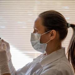 Female medical professional preparing a vaccination